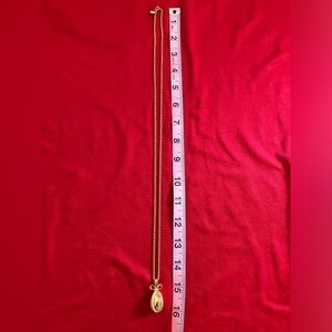 Joan Rivers gold tone egg necklace